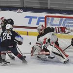 
              Canada's Emerance Maschmeyer (38) makes a save against the United States during the first period of a women's exhibition hockey game ahead of the Beijing Olympics, Friday, Dec. 17, 2021, in Maryland Heights, Mo. (AP Photo/Michael Thomas)
            