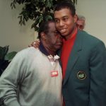 
              FILE - Masters champion Tiger Woods, right, gets a hug from Lee Elder after the final round of Masters play at the Augusta National Golf Club in Augusta, Ga., Sunday, April 13, 1997. Hank Aaron made history with one swing of his bat. A year later and on the other side of Georgia, Elder made history with one swing of his driver. Their deaths in 2021 were mourned beyond the sports world and were reminders of the hate, hardships and obstacles they endured with dignity on their way to breaking records and barriers. (AP Photo/Amy Sancetta, File)
            