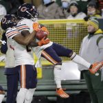 
              Chicago Bears' Jakeem Grant Sr. is congratulated by Khalil Herbert after running a punt back for a touchdown during the first half of an NFL football game against the Green Bay Packers Sunday, Dec. 12, 2021, in Green Bay, Wis. (AP Photo/Aaron Gash)
            
