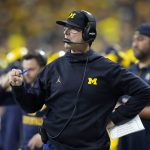 
              Michigan head coach Jim Harbaugh watches from the sideline during the first half of the Big Ten championship NCAA college football game against Iowa, Saturday, Dec. 4, 2021, in Indianapolis. (AP Photo/AJ Mast)
            