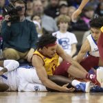 
              Iowa State's Robert Jones (12), center, scrambles for a loose ball against Creighton's KeyShawn Feazell (1), left, and Ryan Nembhard (2) during the first half of an NCAA college basketball game Saturday, Dec. 4, 2021, at CHI Health Center in Omaha, Neb. (AP Photo/Rebecca S. Gratz)
            