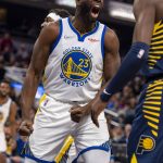 
              Golden State Warriors forward Draymond Green (23) reacts after scoring during the first half of an NBA basketball game against the Indiana Pacers in Indianapolis, Monday, Dec. 13, 2021. (AP Photo/Doug McSchooler)
            
