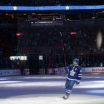 
              Toronto Maple Leafs defenseman Morgan Rielly (44) takes the ice as the first star of the game following the team's win over the Columbus Blue Jackets in an NHL hockey game Tuesday, Dec. 7, 2021, in Toronto. (Cole Burston/The Canadian Press via AP)
            