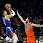 
              Phoenix Suns guard Landry Shamet, left, shoots over Oklahoma City Thunder guard Ty Jerome (16) during the first half of an NBA basketball game Wednesday, Dec. 29, 2021, in Phoenix. (AP Photo/Ross D. Franklin)
            
