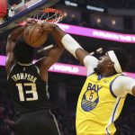 
              Sacramento Kings forward Tristian Thompson (13) has his shot blocked by Golden State Warriors forward Kevon Looney (5) during the first half of an NBA basketball game in San Francisco, Monday, Dec. 20, 2021. (AP Photo/Jed Jacobsohn)
            