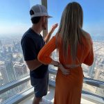 
              NASCAR champion Kyle Larson and his wife, Katelyn, look out over Dubai from the Burj Khalifa skyscraper on Tuesday, Dec. 14, 2021. Larson attended his first ever F1 race as part of his weeklong visit to Dubai and Abu Dhabi during a vacation following his Cup championship win. (AP Photo/Jenna Fryer)
            