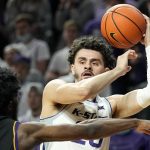 
              Kansas State's Ismael Massoud, right, looks to pass under pressure from Albany's Jamel Horton (5) during the first half of an NCAA college basketball game Wednesday, Dec. 1, 2021, in Manhattan, Kan. (AP Photo/Charlie Riedel)
            