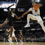 
              Butler guard Aaron Thompson (2) grabs a rebound ahead of Purdue forward Trevion Williams (50) during the first half of an NCAA college basketball game, Saturday, Dec. 18, 2021 in Indianapolis. (AP Photo/AJ Mast)
            