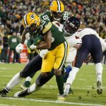 
              Green Bay Packers' Aaron Jones runs for a touchdown during the second half of an NFL football game against the Chicago Bears Sunday, Dec. 12, 2021, in Green Bay, Wis. (AP Photo/Morry Gash)
            