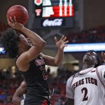 
              Arkansas State's Marquis Eaton (23) shoots the ball over Texas Tech's Davion Warren (2) during the first half of an NCAA college basketball game on Tuesday, Dec. 14, 2021, in Lubbock, Texas. (AP Photo/Brad Tollefson)
            