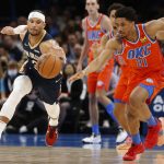 
              New Orleans Pelicans guard Josh Hart (3) and Oklahoma City Thunder guard Aaron Wiggins (21) fight for the ball during the first half of an NBA basketball game, Sunday, Dec. 26, 2021, in Oklahoma City. (AP Photo/Garett Fisbeck)
            