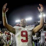 
              FILE -  Alabama quarterback Bryce Young (9) celebrates after defeating Auburn in an NCAA college football game Saturday, Nov. 27, 2021, in Auburn, Ala.. (AP Photo/Butch Dill, File)
            