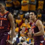 
              Virginia Tech forward David N'Guessan (1) and forward Keve Aluma (22) react after a basket against Maryland during the second half of an NCAA college basketball game, Wednesday, Dec. 1, 2021, in College Park, Md. Virginia Tech won 62-58. (AP Photo/Julio Cortez)
            