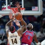 
              New Orleans Pelicans forward Brandon Ingram (14) shoots against Detroit Pistons forward Jerami Grant (9) in the first half of an NBA basketball game in New Orleans, Friday, Dec. 10, 2021. (AP Photo/Gerald Herbert)
            