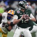 
              Michigan State quarterback Payton Thorne (10) looks to pass against Pittsburgh during the first half of the Peach Bowl NCAA college football game, Thursday, Dec. 30, 2021, in Atlanta. (AP Photo/John Bazemore)
            