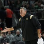 
              Oakland head coach Greg Kampe yells from the sideline during the first half of an NCAA college basketball game against Michigan State , Tuesday, Dec. 21, 2021, in Detroit. (AP Photo/Carlos Osorio)
            