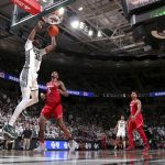 
              Michigan State's Marcus Bingham Jr., left, dunks against Louisville's Malik Williams (5) as Noah Locke (0) and Matt Cross (33) and Michigan State's Malik Hall (25) watch during the second half of an NCAA college basketball game, Wednesday, Dec. 1, 2021, in East Lansing, Mich. (AP Photo/Al Goldis)
            