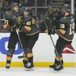 
              Vegas Golden Knights center Jonathan Marchessault (81) celebrates with center William Karlsson (71) after scoring during the first period of the team's NHL hockey game against the Los Angeles Kings on Tuesday, Dec. 28, 2021, in Los Angeles. (AP Photo/Ashley Landis)
            