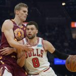 
              Chicago Bulls' Zach LaVine (8) drives against Cleveland Cavaliers' Lauri Markkanen (24) in the first half of an NBA basketball game, Wednesday, Dec. 8, 2021, in Cleveland. (AP Photo/Tony Dejak)
            