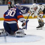 
              New York Islanders goalie Ilya Sorokin (30) makes a save on Vegas Golden Knights' William Carrier (28) during the first period of an NHL hockey game, Sunday, Dec. 19, 2021, in Elmont, N.Y. (AP Photo/John Munson)
            
