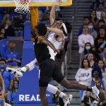 
              UCLA guard Jaime Jaquez Jr., right, is fouled by Colorado forward Jabari Walker during the first half of an NCAA college basketball game in Los Angeles, Wednesday, Dec. 1, 2021. (AP Photo/Ashley Landis)
            
