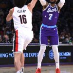 
              Los Angeles Lakers forward Carmelo Anthony (7) shoots a 3-point basket over Portland Trail Blazers guard CJ Elleby (16) during the first half of an NBA basketball game Friday Dec. 31, 2021, in Los Angeles. (AP Photo/John McCoy)
            