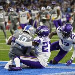 
              Detroit Lions wide receiver Amon-Ra St. Brown (14) catches a 11-yard pass for a touchdown in the last second sof play during the second half of an NFL football game against the Minnesota Vikings, Sunday, Dec. 5, 2021, in Detroit. (AP Photo/Paul Sancya)
            