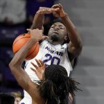
              Kansas State's Kaosi Ezeagu (20) blocks a shot by Albany's Aaron Reddish during the first half of an NCAA college basketball game Wednesday, Dec. 1, 2021, in Manhattan, Kan. (AP Photo/Charlie Riedel)
            