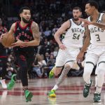 
              Toronto Raptors' Fred VanVleet drives against Milwaukee Bucks' George Hill (3) during the second half of an NBA basketball game Thursday, Dec. 2, 2021, in Toronto. (Chris Young/The Canadian Press via AP)
            