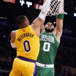
              Boston Celtics forward Jayson Tatum, right, shoots over Los Angeles Lakers guard Russell Westbrook during the first half of an NBA basketball game Tuesday, Dec. 7, 2021, in Los Angeles. (AP Photo/Marcio Jose Sanchez)
            