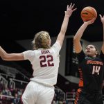 
              Pacific center Elizabeth Elliott (14) shoots against Stanford forward Cameron Brink (22) during the first half of an NCAA college basketball game in Stanford, Calif., Sunday, Dec. 12, 2021. (AP Photo/Jeff Chiu)
            