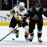 
              Arizona Coyotes left wing Loui Eriksson (21) keeps the puck away from Vegas Golden Knights left wing Max Pacioretty (67) during the first period of an NHL hockey game Friday, Dec. 3, 2021, in Glendale, Ariz. (AP Photo/Ross D. Franklin)
            