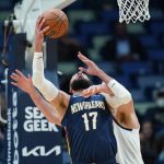 
              New Orleans Pelicans center Jonas Valanciunas (17) goes to the basket against Denver Nuggets center Nikola Jokic in the first half of an NBA basketball game in New Orleans, Wednesday, Dec. 8, 2021. (AP Photo/Gerald Herbert)
            