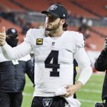 
              Las Vegas Raiders quarterback Derek Carr gives a thumbs-up after his team defeated the Cleveland Browns in an NFL football game, Monday, Dec. 20, 2021, in Cleveland. (AP Photo/Ron Schwane)
            