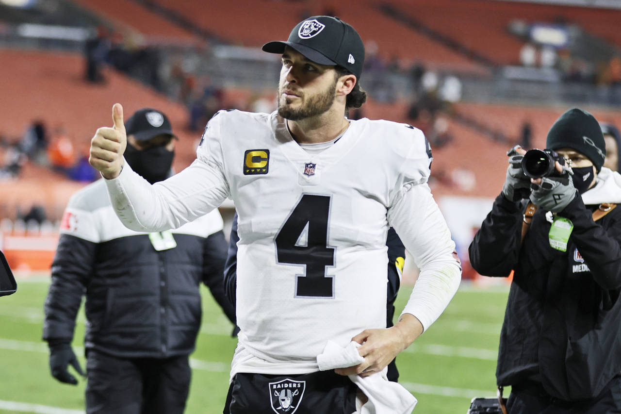 Las Vegas Raiders quarterback Derek Carr gives a thumbs-up after his team defeated the Cleveland Br...
