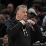 
              Purdue head coach Matt Painter watches from the bench during the first half of an NCAA college basketball game against Butler, Saturday, Dec. 18, 2021, in Indianapolis. (AP Photo/AJ Mast)
            