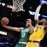 
              Boston Celtics forward Jayson Tatum (0) drives to the basket while Los Angeles Lakers forward LeBron James (6) defends during the first half of an NBA basketball game Tuesday, Dec. 7, 2021, in Los Angeles. (AP Photo/Marcio Jose Sanchez)
            