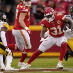 
              Kansas City Chiefs running back Darrel Williams (31) runs with the ball as Pittsburgh Steelers safety Terrell Edmunds (34) defends during the first half of an NFL football game Sunday, Dec. 26, 2021, in Kansas City, Mo. (AP Photo/Charlie Riedel)
            