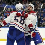
              Montreal Canadiens defenseman David Savard (58) celebrates his goal against the Tampa Bay Lightning with right wing Alex Belzile (60) during the third period of an NHL hockey game Tuesday, Dec. 28, 2021, in Tampa, Fla. (AP Photo/Chris O'Meara)
            