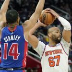 
              New York Knicks center Taj Gibson (67) looks to pass as Detroit Pistons guard Cassius Stanley (14) defends during the second half of an NBA basketball game, Wednesday, Dec. 29, 2021, in Detroit. (AP Photo/Carlos Osorio)
            
