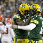 
              Green Bay Packers' Davante Adams celebrates his touchdown reception with Aaron Rodgers during the first half of an NFL football game against the Cleveland Browns Saturday, Dec. 25, 2021, in Green Bay, Wis. (AP Photo/Matt Ludtke)
            