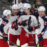 
              Columbus Blue Jackets forward Alexandre Texier, third from left, is congratulated by teammates after scoring a goal during the second period of an NHL hockey game against the Dallas Stars, Thursday, Dec. 2, 2021, in Dallas. (AP Photo/Brandon Wade)
            