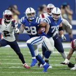 
              Indianapolis Colts running back Jonathan Taylor (28) runs for a 67-yard touchdown during the second half of an NFL football game against the New England Patriots Saturday, Dec. 18, 2021, in Indianapolis. (AP Photo/AJ Mast)
            