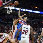 
              Washington Wizards forward Kyle Kuzma (33) shoots as Miami Heat center Omer Yurtseven, center, and guard Duncan Robinson (55) defend during the first half of an NBA basketball game, Tuesday, Dec. 28, 2021, in Miami. (AP Photo/Lynne Sladky)
            