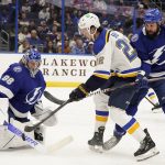 
              Tampa Bay Lightning goaltender Andrei Vasilevskiy (88) makes a stick save on a shot by St. Louis Blues center Logan Brown (22) during the first period of an NHL hockey game Thursday, Dec. 2, 2021, in Tampa, Fla. Looking on for the Lightning is defenseman Zach Bogosian (24). (AP Photo/Chris O'Meara)
            