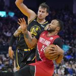 
              Portland Trail Blazers forward Norman Powell (24) drives to the basket against Golden State Warriors forward Nemanja Bjelica (8) during the first half of an NBA basketball game in San Francisco, Wednesday, Dec. 8, 2021. (AP Photo/Jeff Chiu)
            