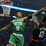 
              Boston Celtics guard Romeo Langford (9) defends against Los Angeles Clippers guard Eric Bledsoe (12) during the first half of an NBA basketball game in Los Angeles, Wednesday, Dec. 8, 2021. (AP Photo/Ashley Landis)
            