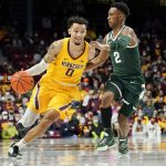 
              Minnesota guard Payton Willis (0) drives past Michigan State guard Tyson Walker during the first half an NCAA college basketball game Wednesday, Dec. 8, 2021, in Minneapolis. (AP Photo/Craig Lassig)
            
