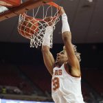
              Texas forward Tre Mitchell (33) scores against Incarnate Word during the second half of an NCAA college basketball game, Tuesday, Dec. 28, 2021, in Austin, Texas. (AP Photo/Eric Gay)
            