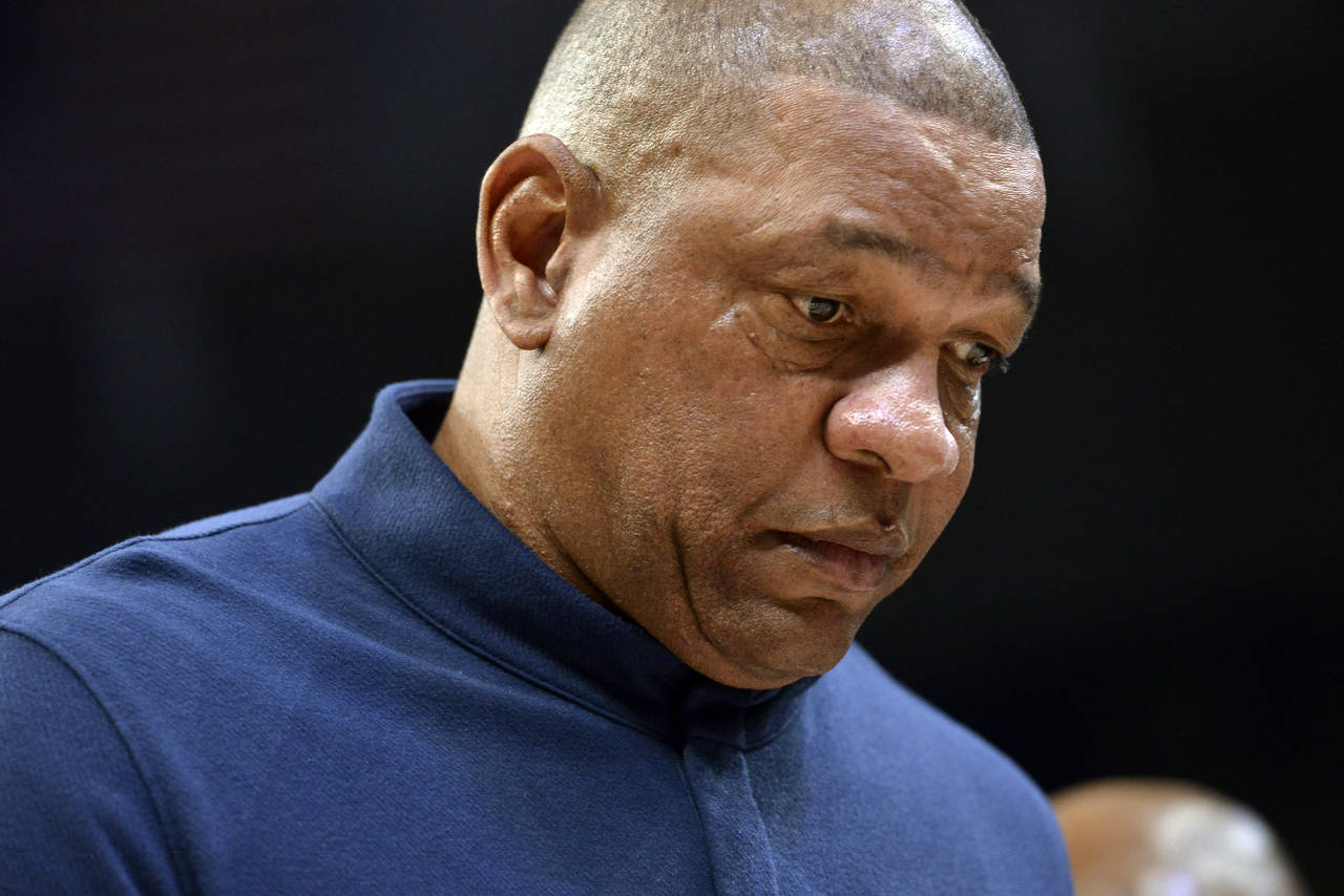 Philadelphia 76ers head coach Doc Rivers walks off the court during halftime of an NBA basketball g...